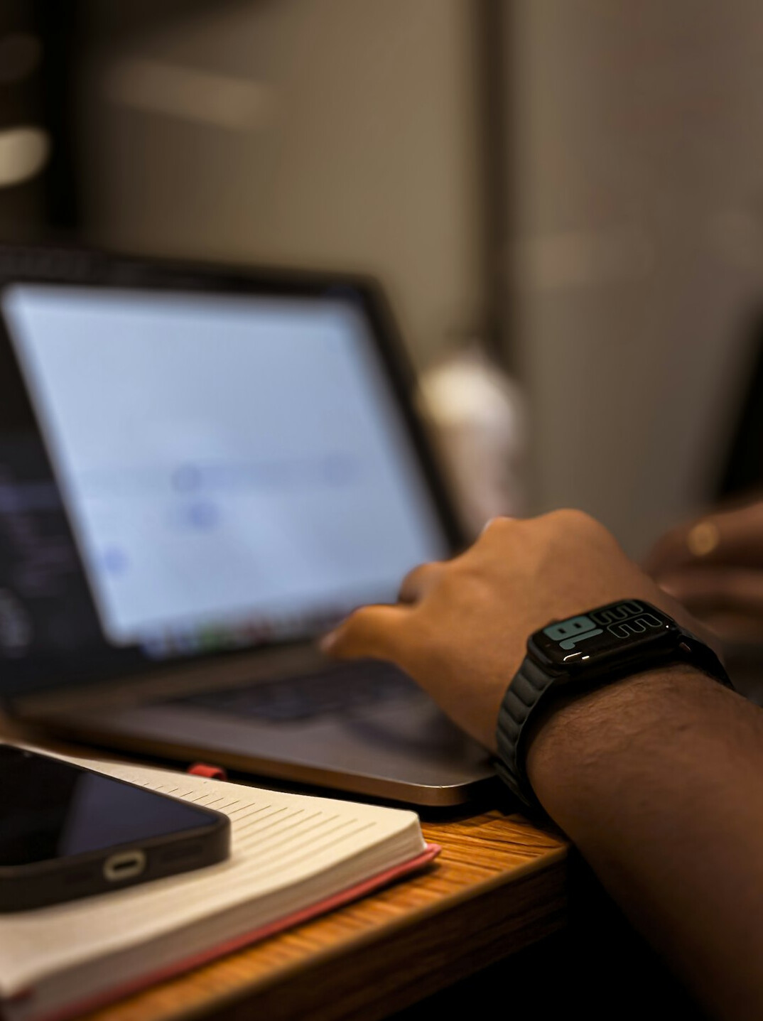 person writing code on laptop