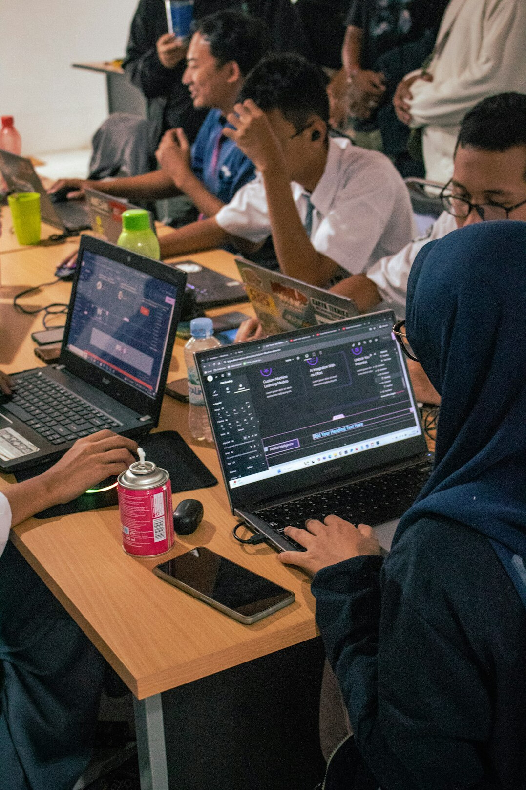group of students coding together